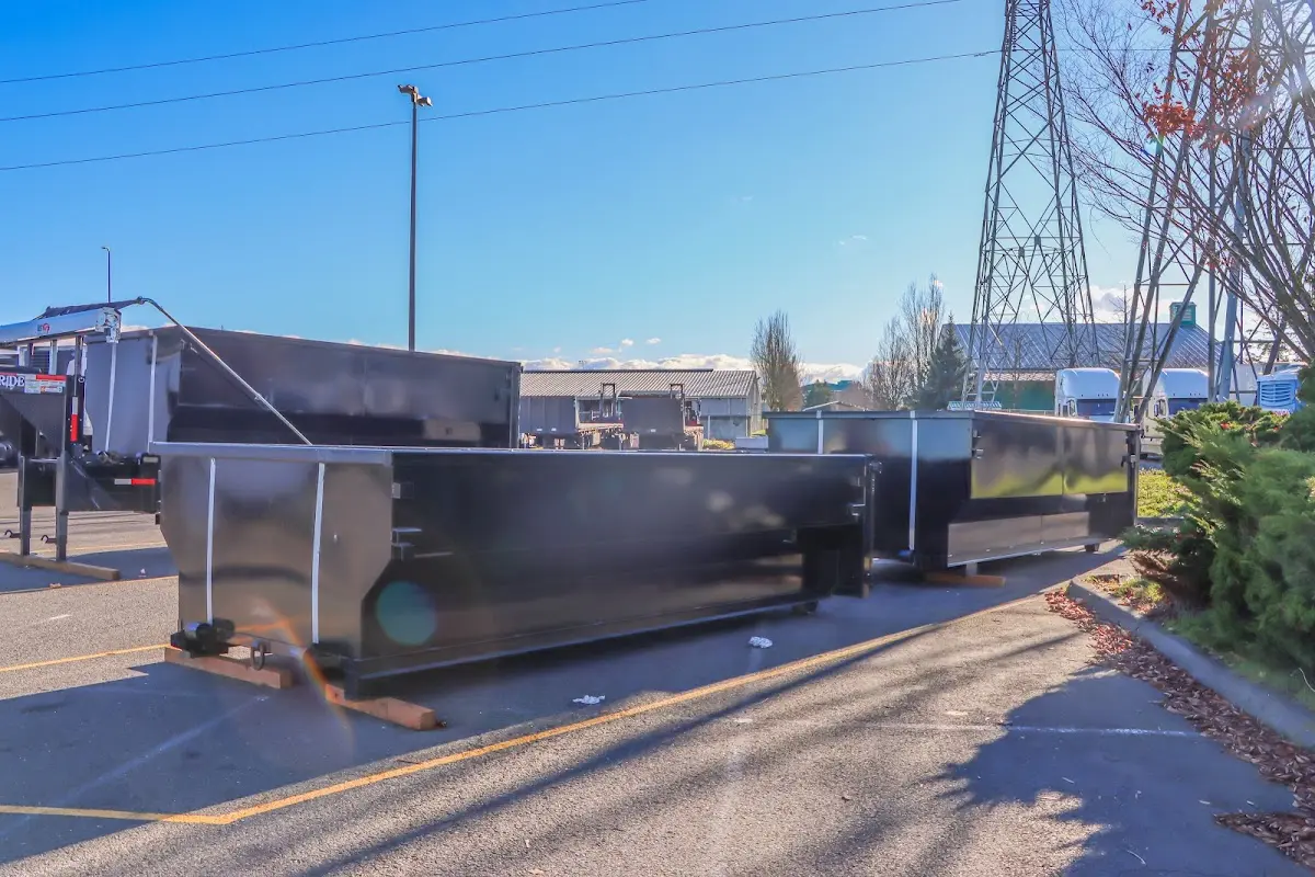 Roll-off dumpster ready for waste disposal at job site for Construction Dumpster Rental in Paris